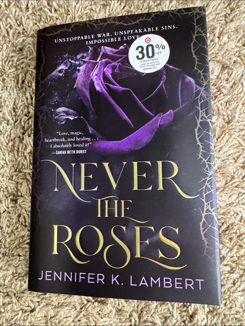 Never the Roses by — Purple Hardcover